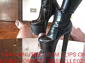 Mistress Elle with her chunky platform boots ruins her slaves cock