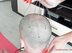 The stepmother uses long nails to massage the head femdom bdsm